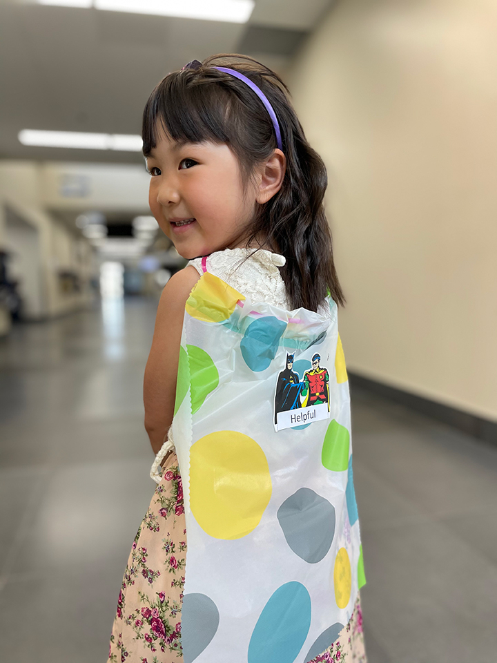 A Girl with Truth badges at SCA Preschool